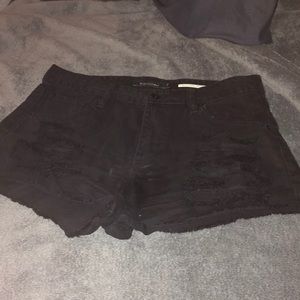 Black ripped shorts